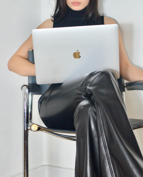 Business woman working on a laptop in her eyelash business