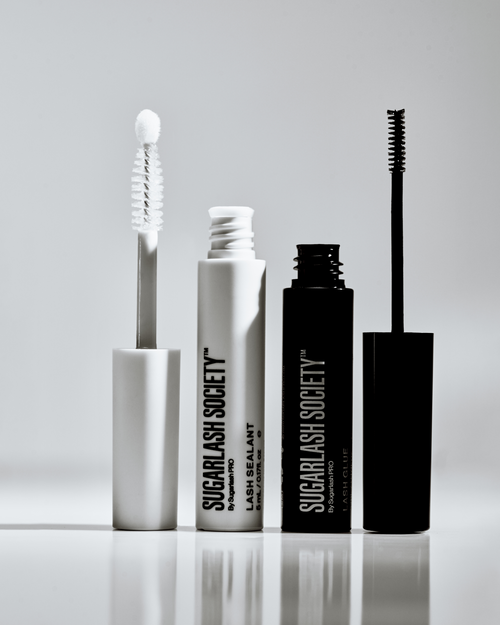 A tube of lash sealant and a tube of lash extensions blue side by side.