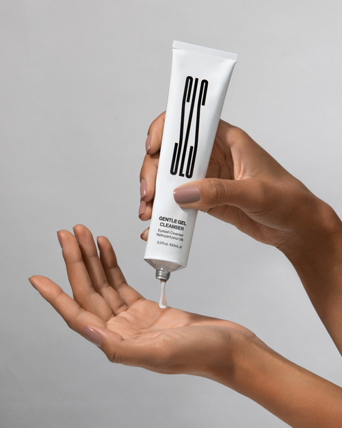 A model squeezing Gentle Gel Cleanser on to their other hand.