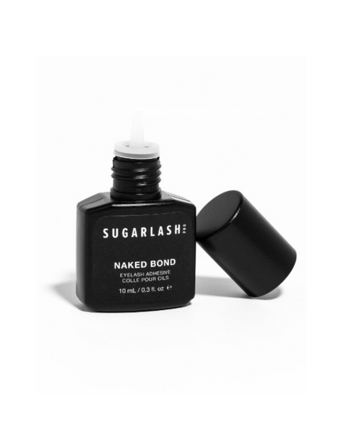 A bottle of Naked Bond clear eyelash glue for extensions.