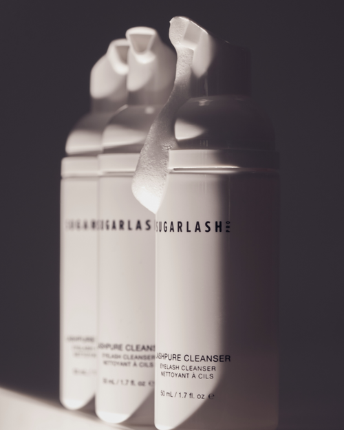 Bottles of foaming LashPURE cleanser for eyelash extensions.
