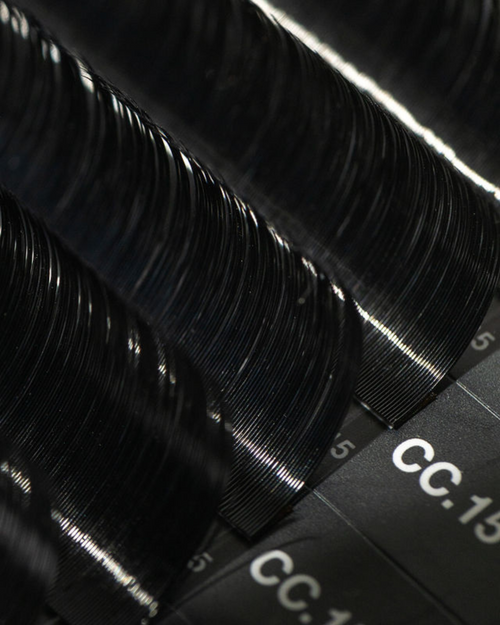 Close up of a tray of eyelash extensions.