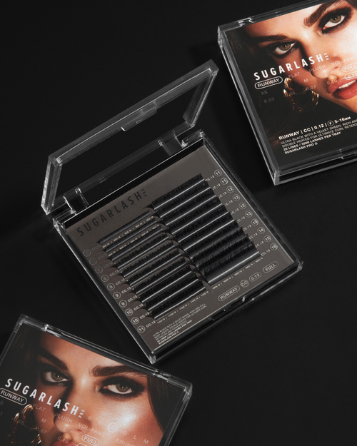 Three trays of Runway Lashes laid out on a black background.