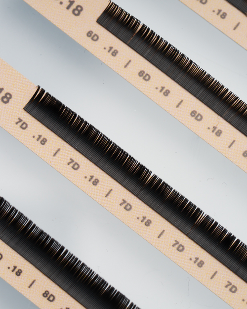 A close up of strips of Flat lashes for eyelash extensions.