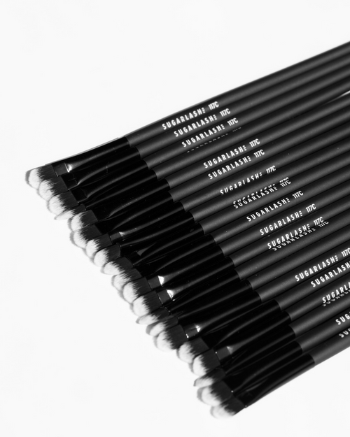 Close up of multiple lash cleansing brushes.