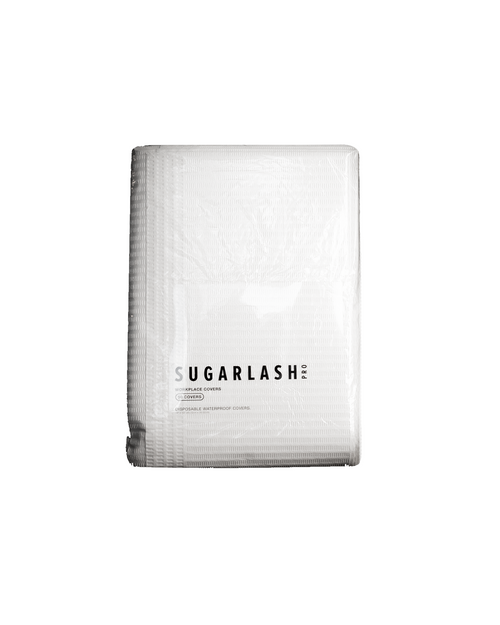 Package of white Lash Artist Workplace Covers on a brighter white background.